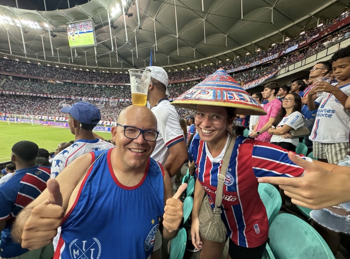 Guests wearing Bahia football colors inside Arena Fonte Nova